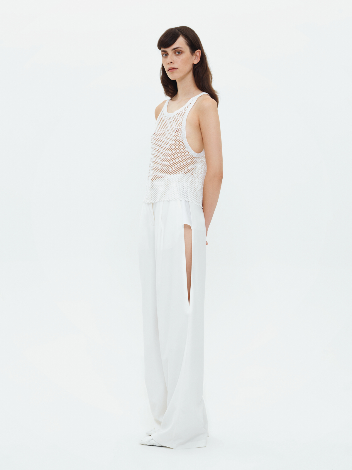 TROUSERS WITH SLITS IN WHITE