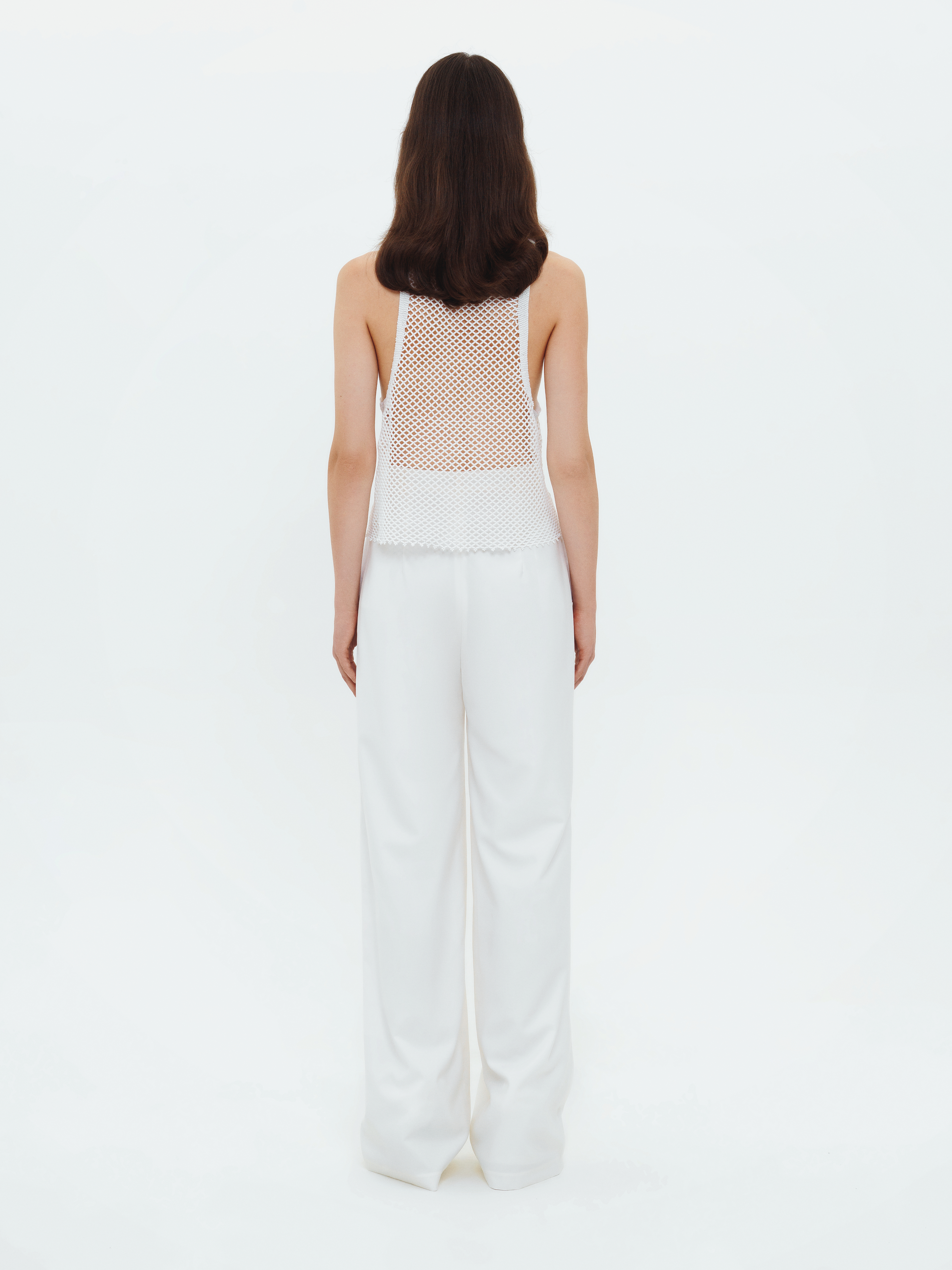 TROUSERS WITH SLITS IN WHITE