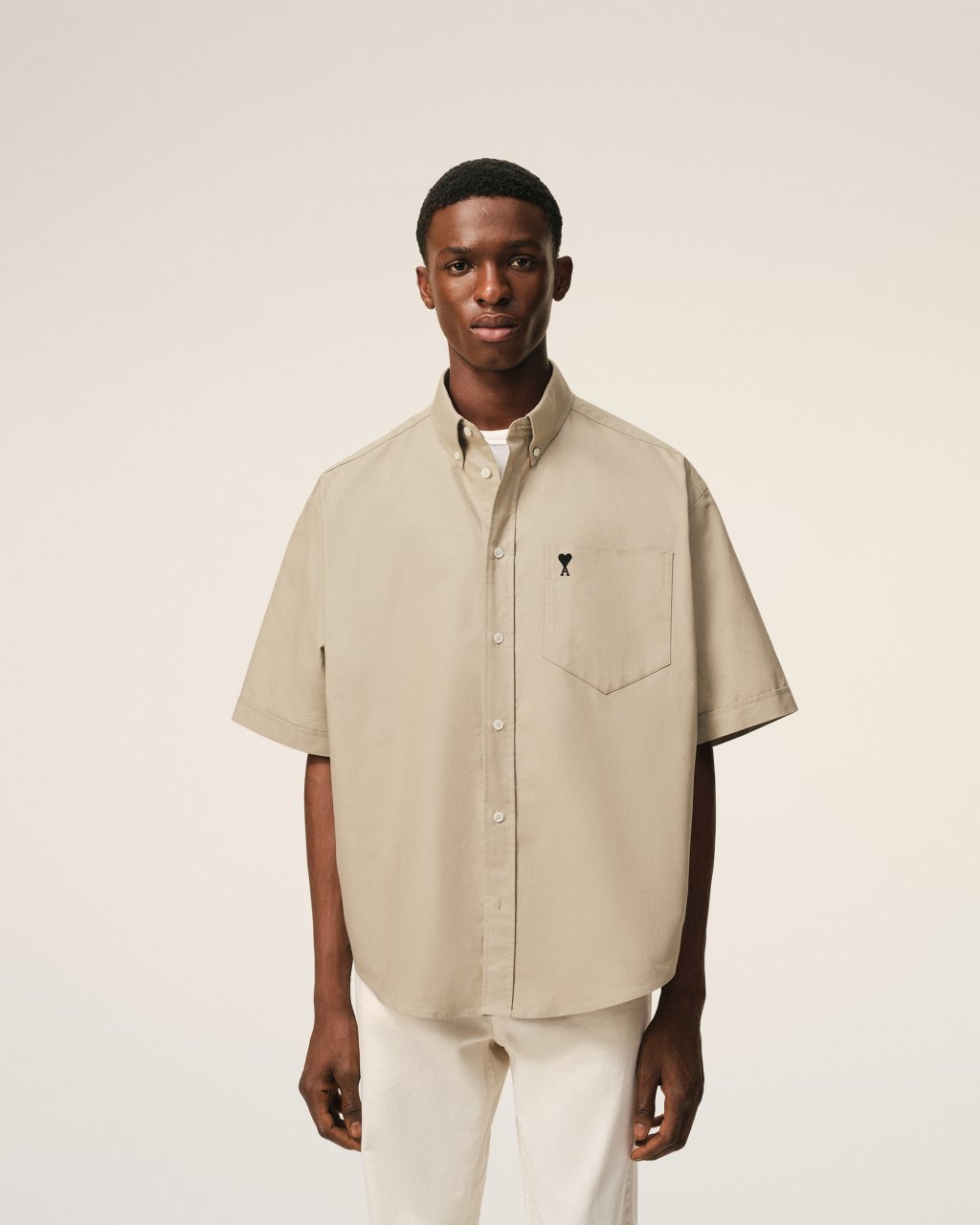 QUOTA -BOXY SHORT SLEEVE SHIRT WITH BUTTON DOWN COLLAR AND EMBROIDERED ADC IN BEIGE TAUPE
