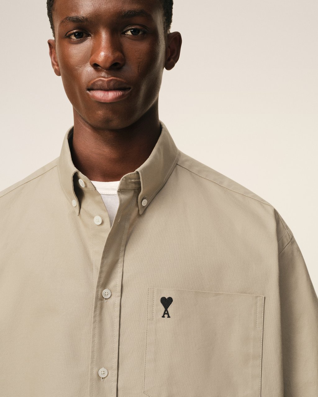 QUOTA -BOXY SHORT SLEEVE SHIRT WITH BUTTON DOWN COLLAR AND EMBROIDERED ADC IN BEIGE TAUPE