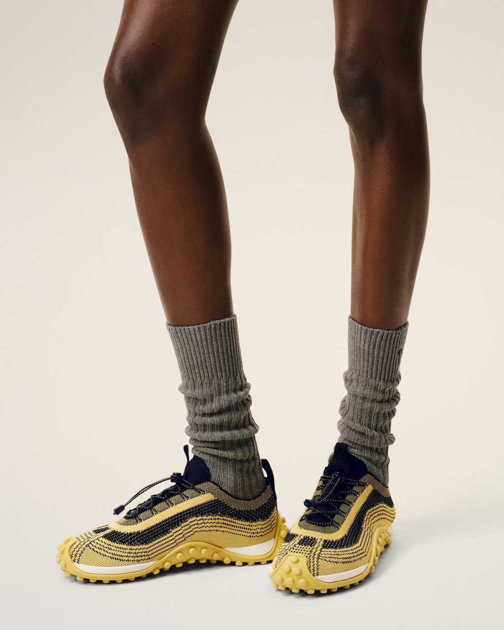 MIRAGE SNEAKERS IN JAUNE PASTEL/NOIR