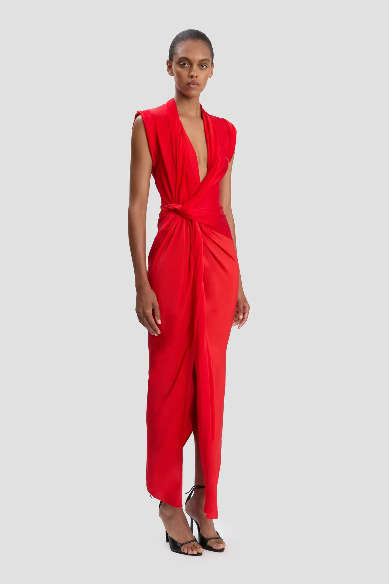 ASYMMETRIC TWIST DETAIL DRESS IN CARDINAL RED