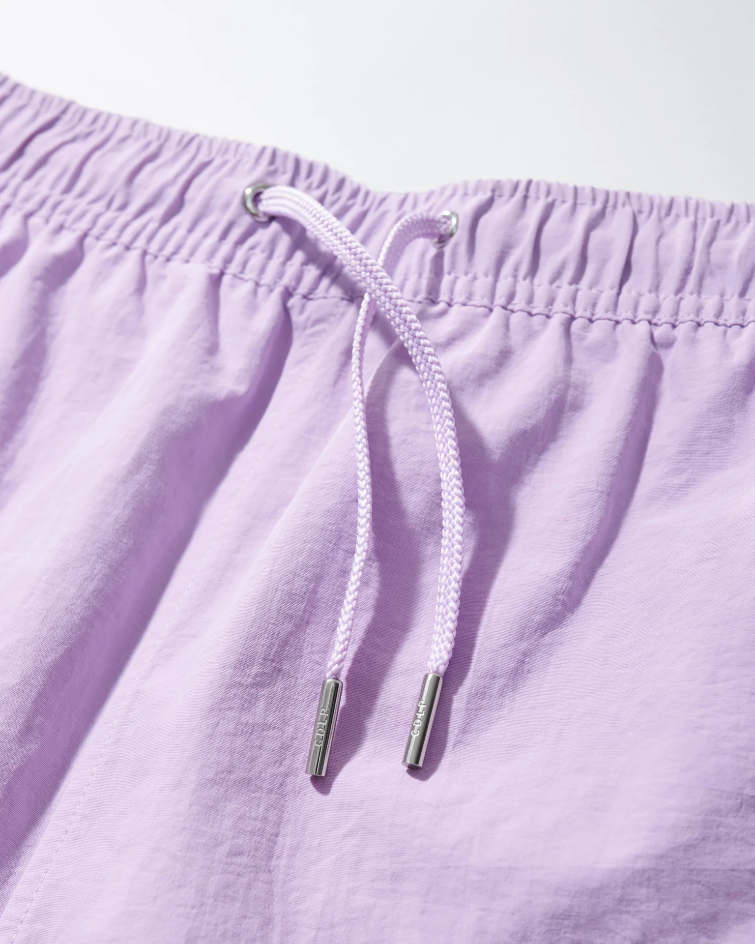 DRY	NYLON POPLIN SWIM TRUNKS IN LILAC