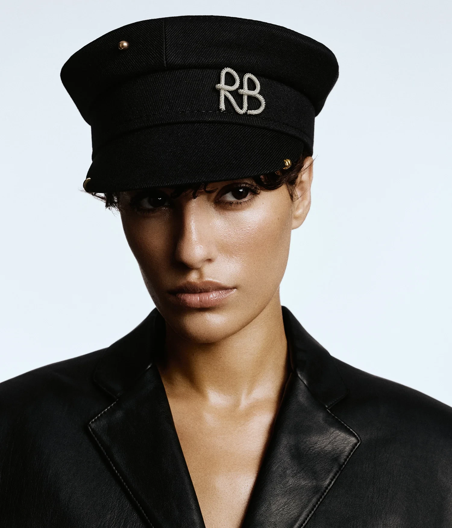 PIERCED BAKER BOY CAP IN BLACK