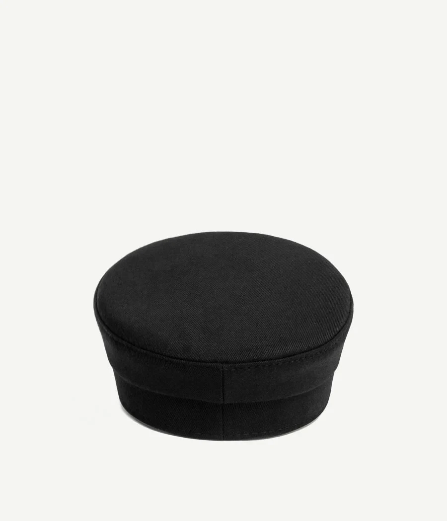 PIERCED BAKER BOY CAP IN BLACK