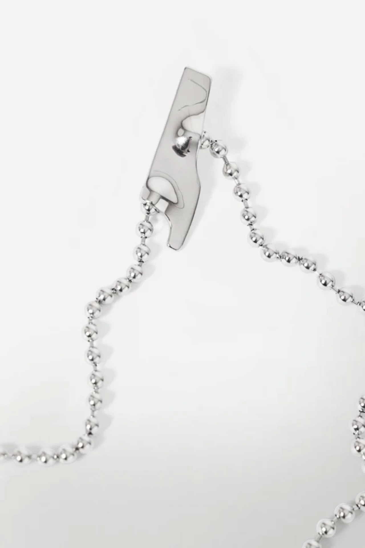 BROOCH MADE OF STAINLESS STEEL WITH FOUR ELEMENTS