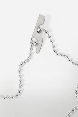 BROOCH MADE OF STAINLESS STEEL WITH FOUR ELEMENTS