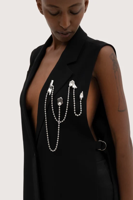 BROOCH MADE OF STAINLESS STEEL WITH FOUR ELEMENTS