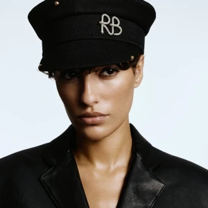 PIERCED BAKER BOY CAP IN BLACK